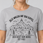Nahaufnahme des Drucks: Der Rest vom Berg ist frei – T-Shirt Unisex in Hellgrau, von einer Frau getragen