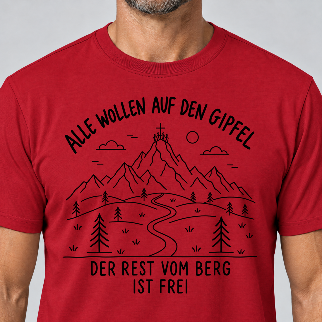 Nahaufnahme des Drucks: Der Rest vom Berg ist frei – T-Shirt Unisex in Rot, von einem Mann getragen