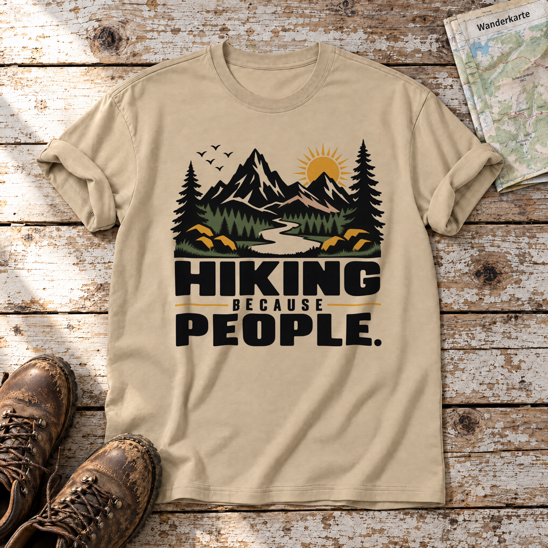 Hiking because people – T-Shirt Unisex in Sand, flach liegend auf alten Holzbrettern mit Wanderschuhen und Wanderkarte.