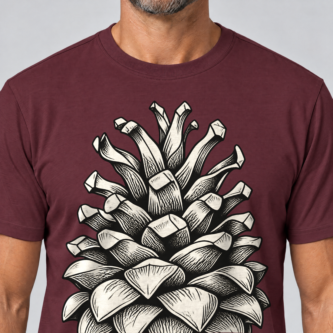 Nahaufnahme des Drucks: Kiefernzapfen – T-Shirt Unisex in Bordeaux, von einem Mann getragen