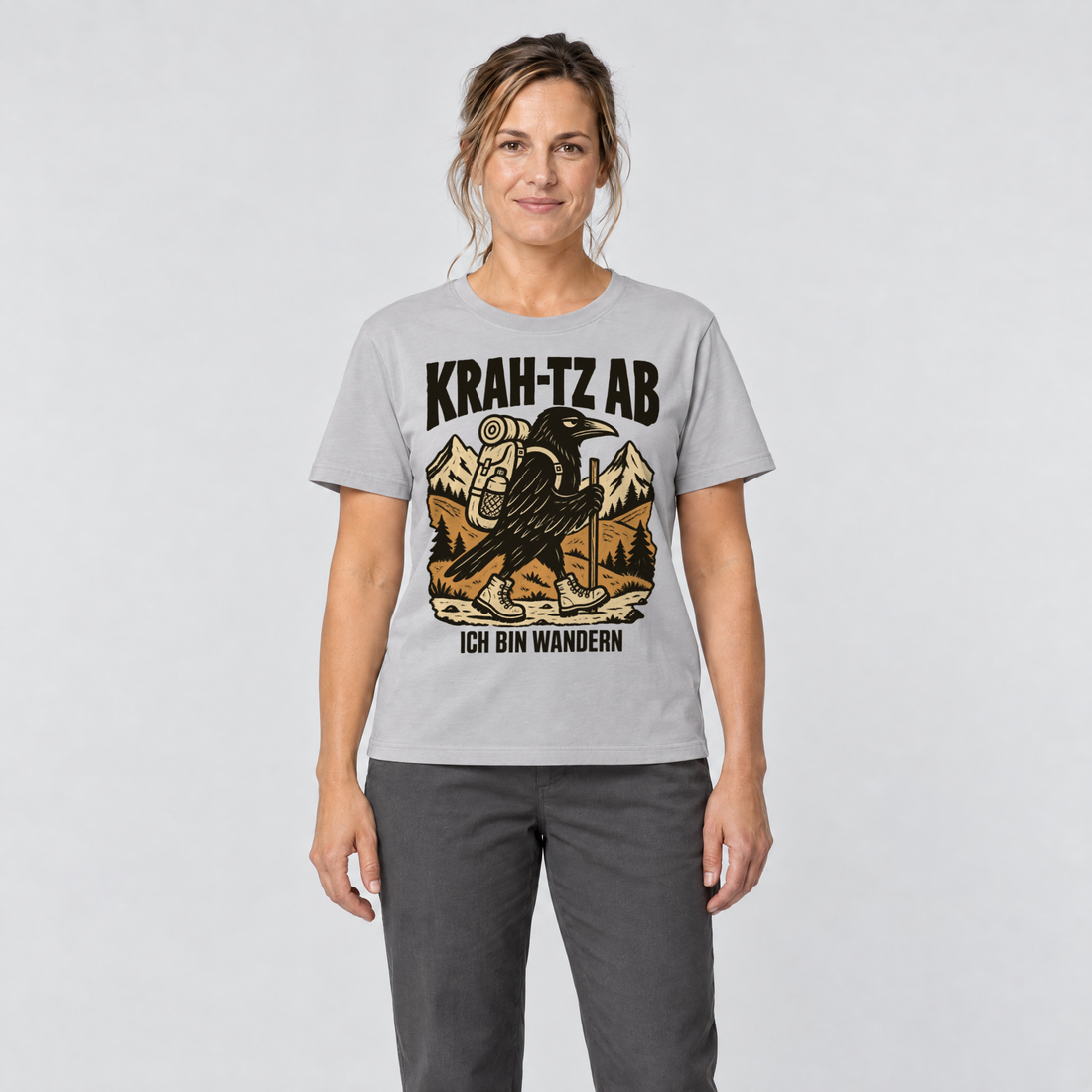Frau trägt Krah-tz ab – T-Shirt Unisex in Hellgrau, Ansicht von vorn