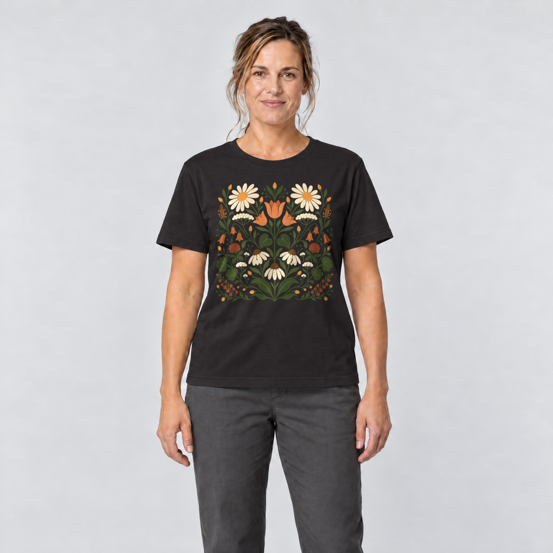 Frau trägt Wiesenblumenstrauß – T-Shirt Unisex in Schwarz, Ansicht von vorn